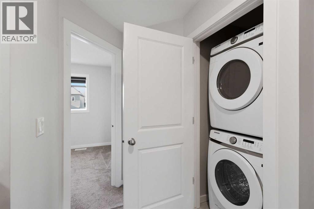 61 Savanna Link Ne, Calgary, AB - Indoor Photo Showing Laundry Room
