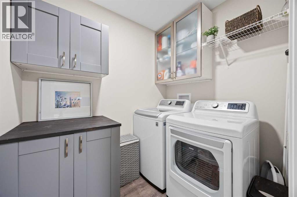 Laundry Room - 80 Wolf Gate, Okotoks, AB - Indoor Photo Showing Laundry Room