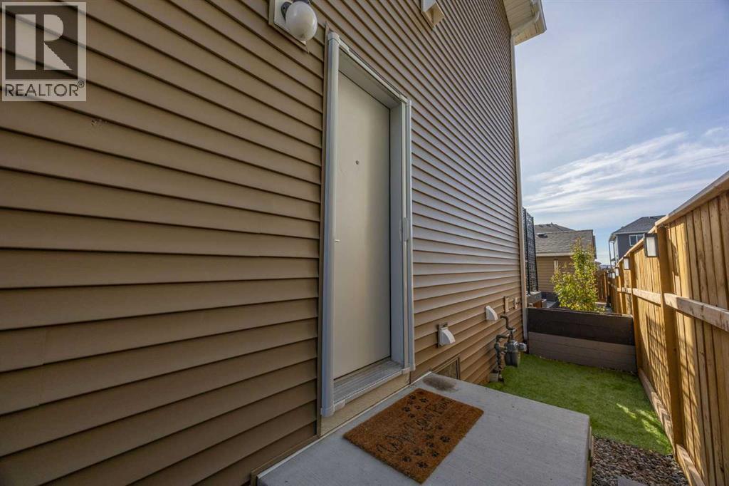 Side Entry - 80 Wolf Gate, Okotoks, AB - Outdoor With Exterior