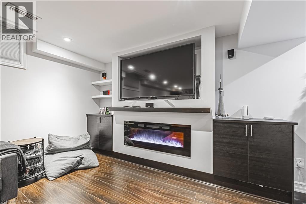 8 Matteo Trail, Hamilton, ON - Indoor Photo Showing Living Room With Fireplace