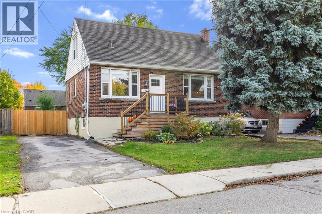 View of front of house featuring brick siding, a chimney, and roof with shingles - 191 East 11Th Street, Hamilton, ON - Outdoor