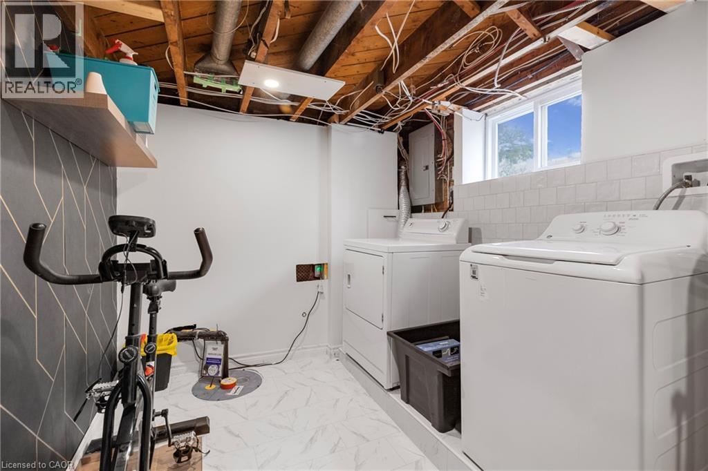 Washroom with independent washer and dryer and electric panel - 191 East 11Th Street, Hamilton, ON - Indoor Photo Showing Laundry Room