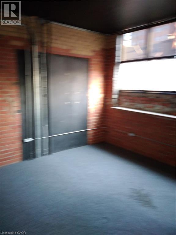 View of unfurnished room - 12 Ferguson Avenue N, Hamilton, ON