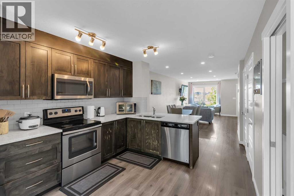 142 Red Embers Gate Ne, Calgary, AB - Indoor Photo Showing Kitchen With Stainless Steel Kitchen With Double Sink With Upgraded Kitchen