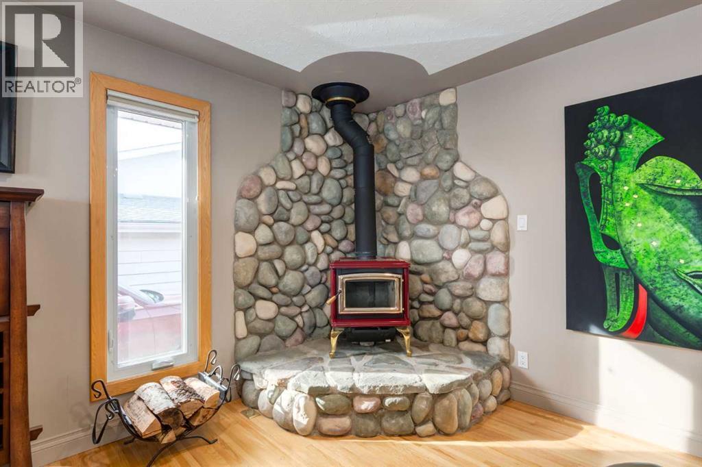 55 Heston Street Nw, Calgary, AB - Indoor With Fireplace