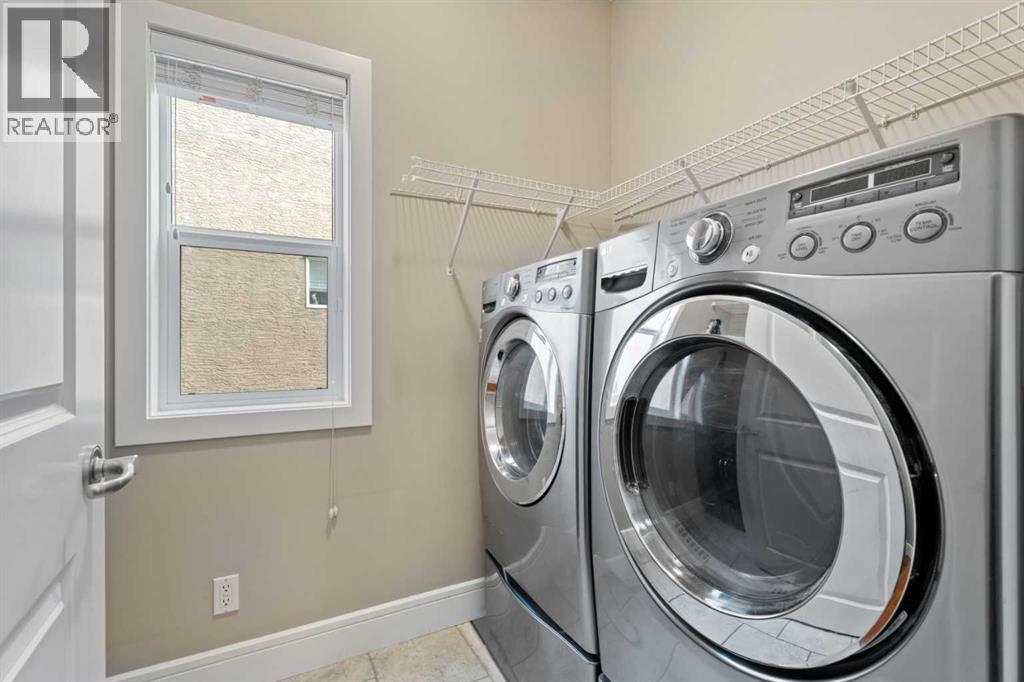 Laundry room on the main floor - 113 Aspen Stone Place Sw, Calgary, AB - Indoor Photo Showing Laundry Room