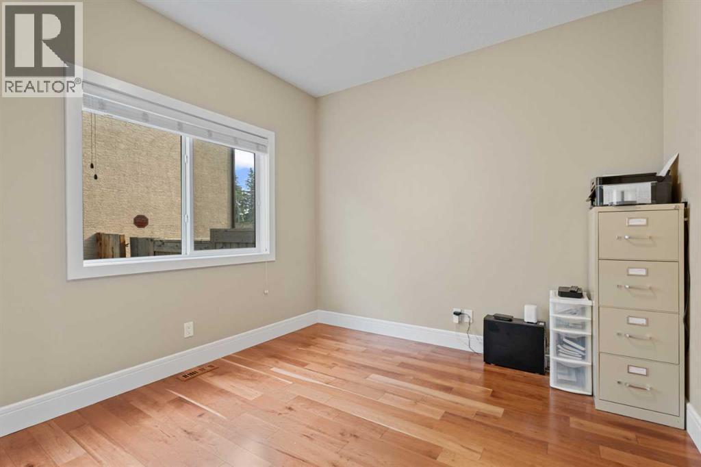 Office on the main floor - 113 Aspen Stone Place Sw, Calgary, AB - Indoor Photo Showing Other Room