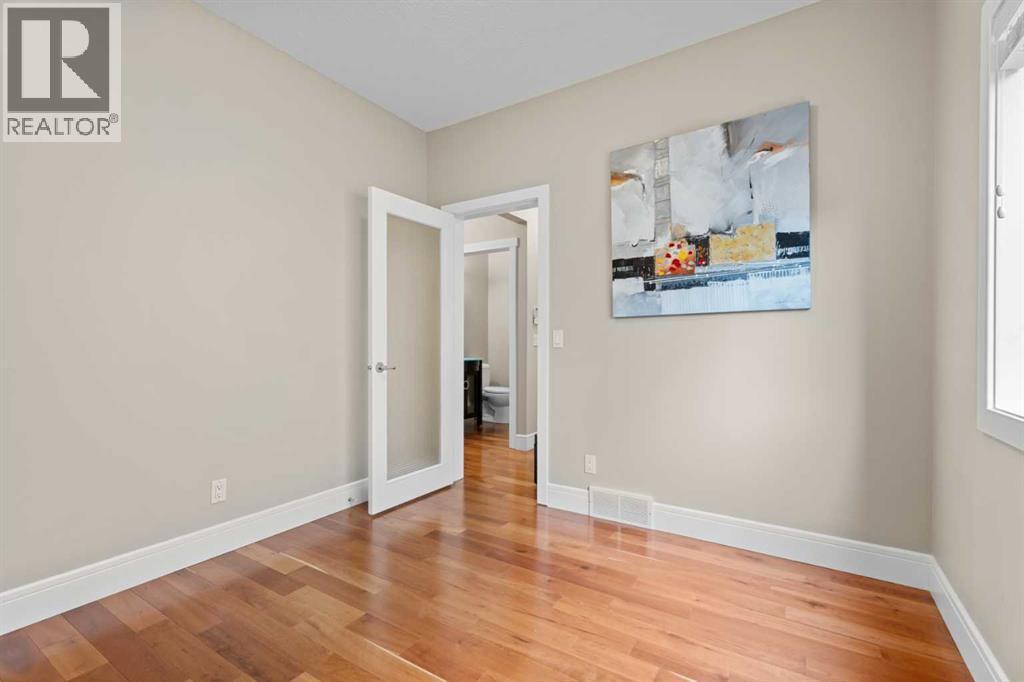 9 foot ceilings throughout the main floor - 113 Aspen Stone Place Sw, Calgary, AB - Indoor Photo Showing Other Room