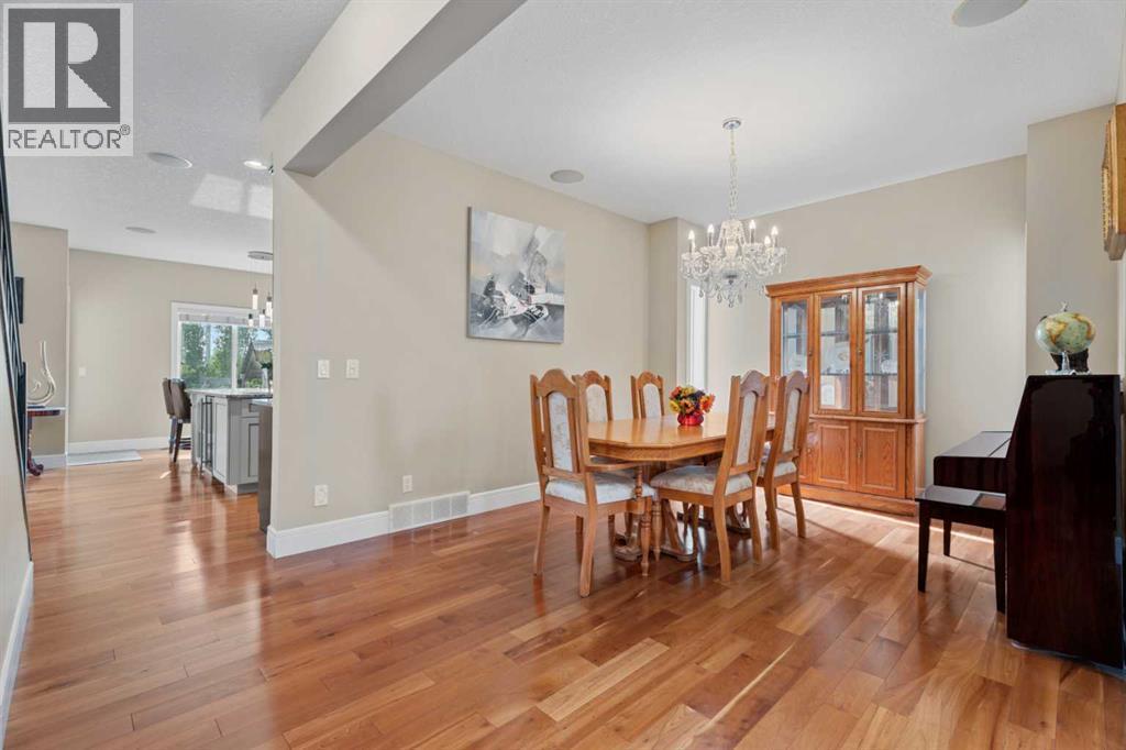 Beautiful cherry wood floors - 113 Aspen Stone Place Sw, Calgary, AB - Indoor Photo Showing Dining Room