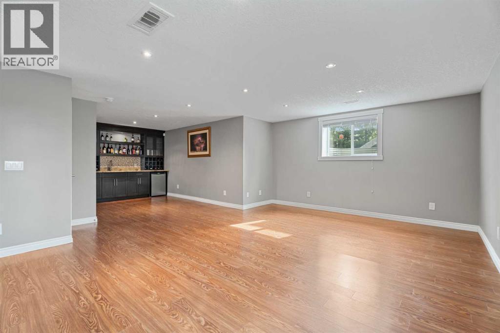 The rec room is very large - 113 Aspen Stone Place Sw, Calgary, AB - Indoor Photo Showing Other Room