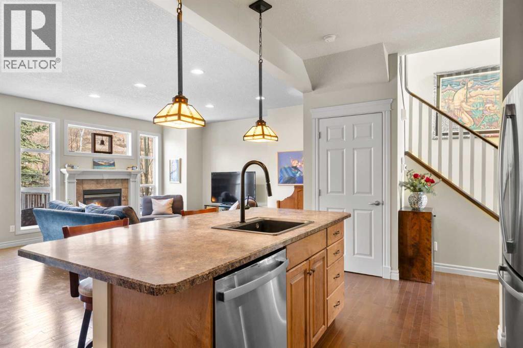90 Discovery Ridge Gardens Sw, Calgary, AB - Indoor Photo Showing Kitchen With Fireplace With Upgraded Kitchen