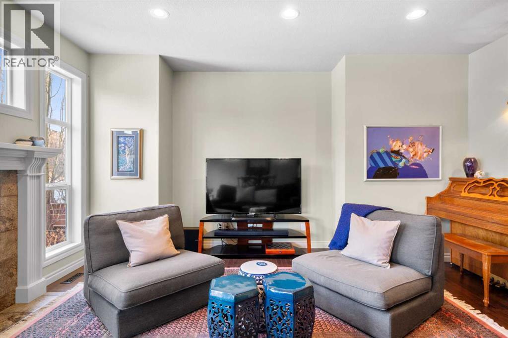 90 Discovery Ridge Gardens Sw, Calgary, AB - Indoor Photo Showing Living Room With Fireplace