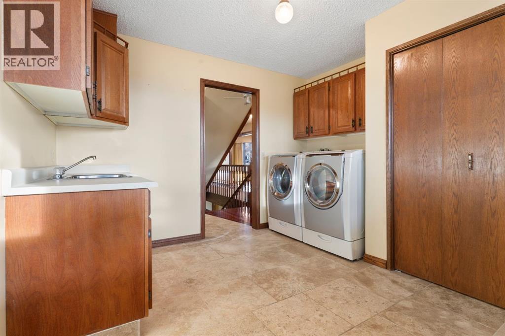 39 Coach Gate Way Sw, Calgary, AB - Indoor Photo Showing Laundry Room