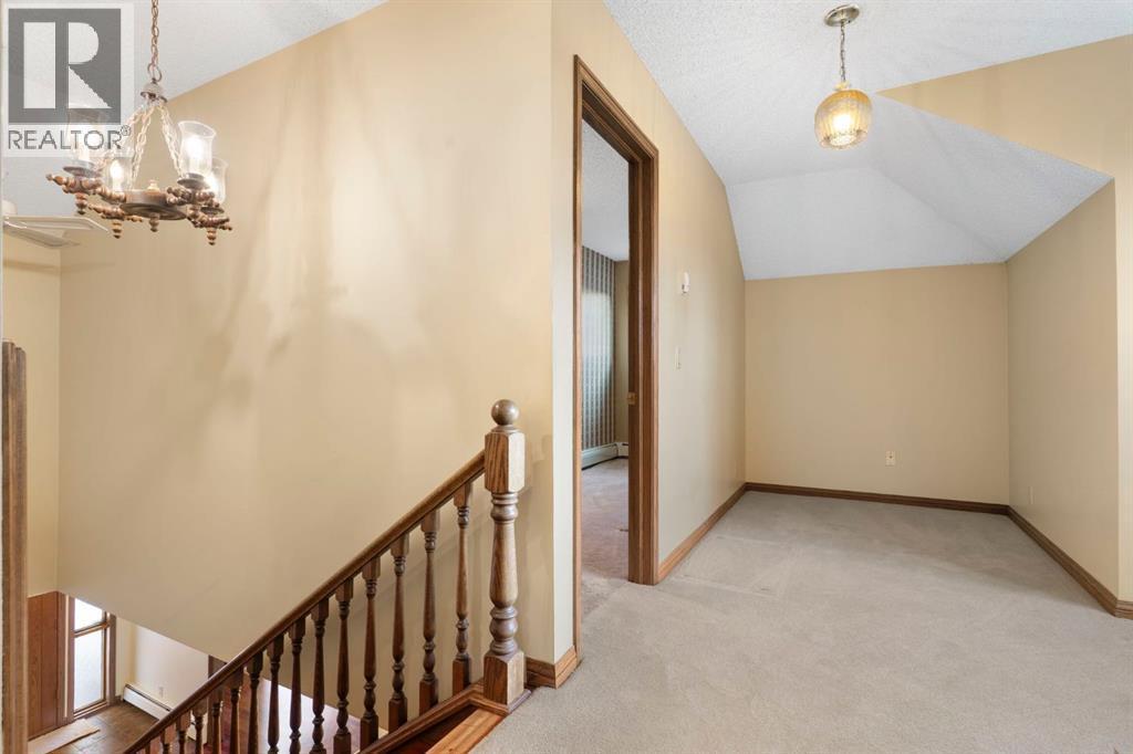 39 Coach Gate Way Sw, Calgary, AB - Indoor Photo Showing Other Room