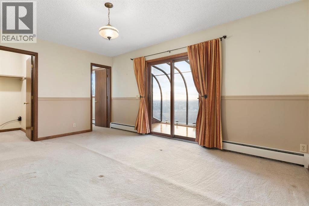 Primary bedroom - 39 Coach Gate Way Sw, Calgary, AB - Indoor Photo Showing Other Room