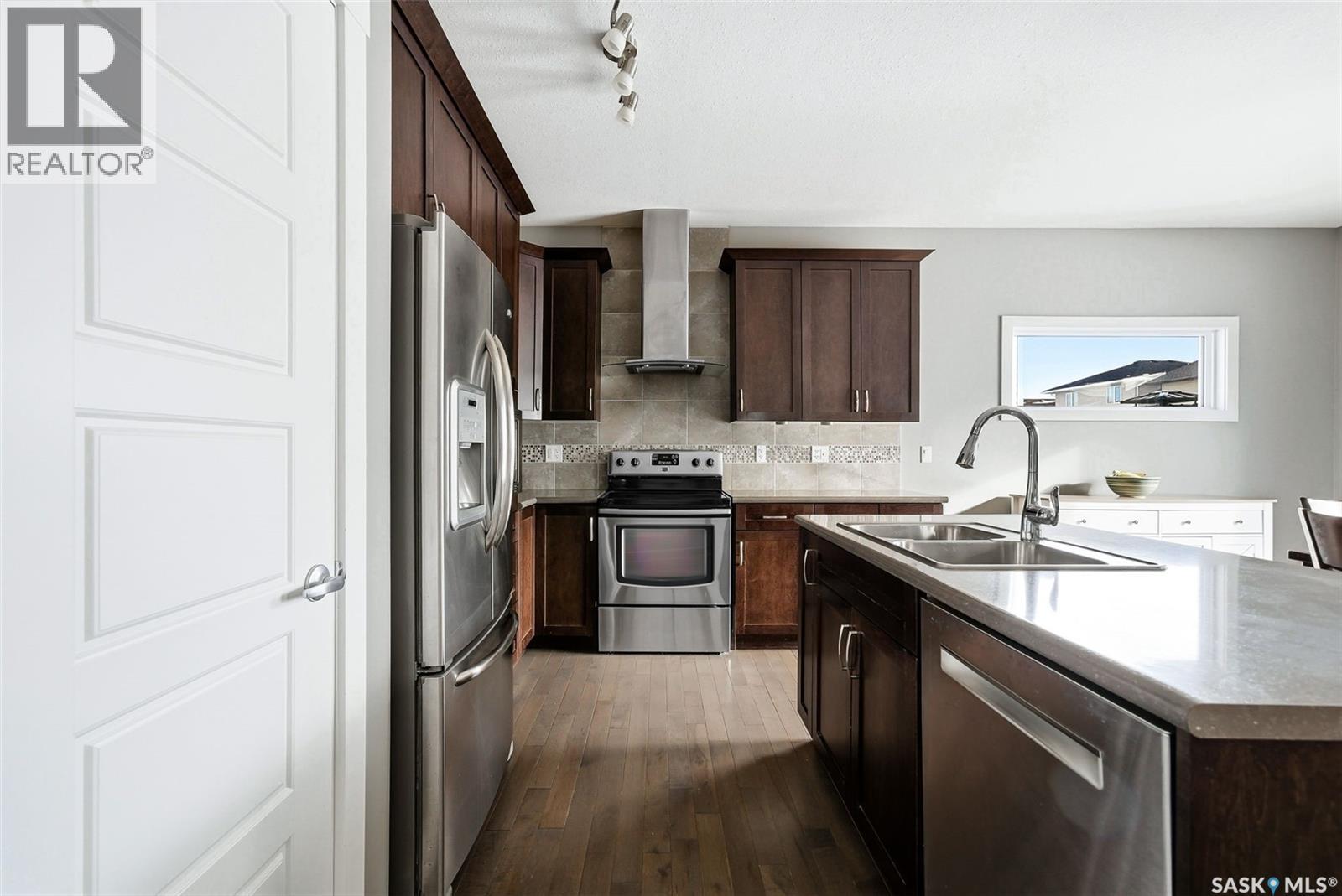 2813 Elgaard Drive, Regina, SK - Indoor Photo Showing Kitchen With Stainless Steel Kitchen With Double Sink