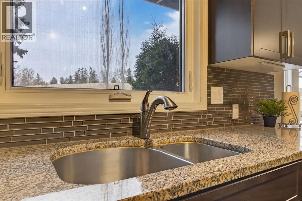 68 Bermondsey Rise Nw, Calgary, AB - Indoor Photo Showing Kitchen With Double Sink