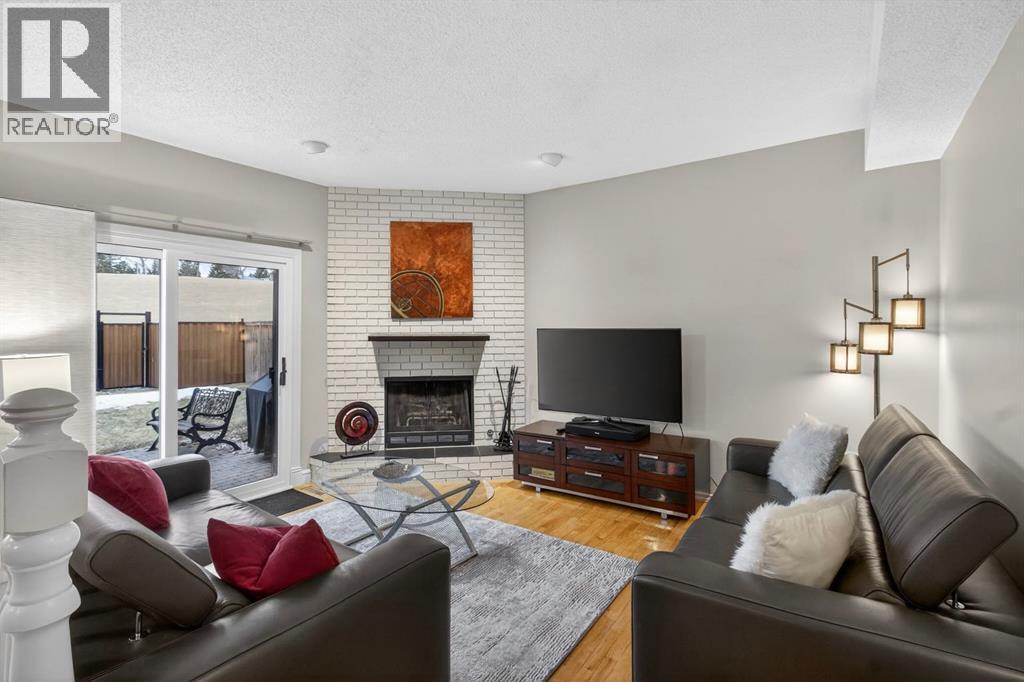 68 Bermondsey Rise Nw, Calgary, AB - Indoor Photo Showing Living Room With Fireplace