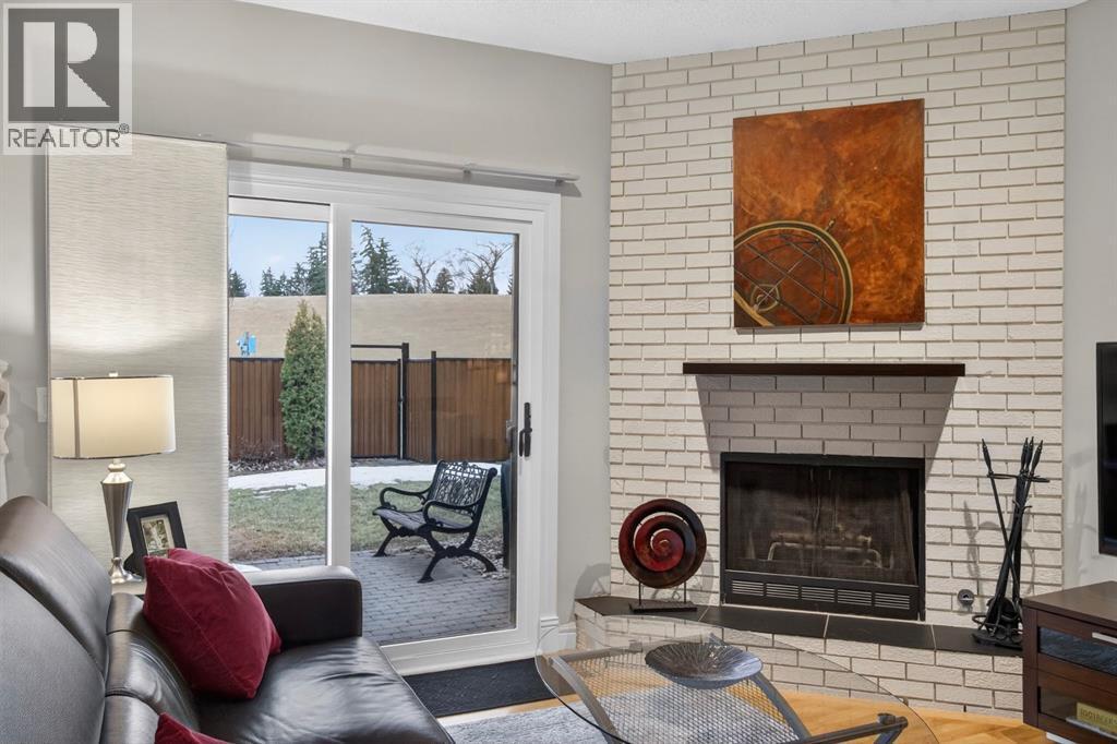 68 Bermondsey Rise Nw, Calgary, AB - Indoor Photo Showing Living Room With Fireplace