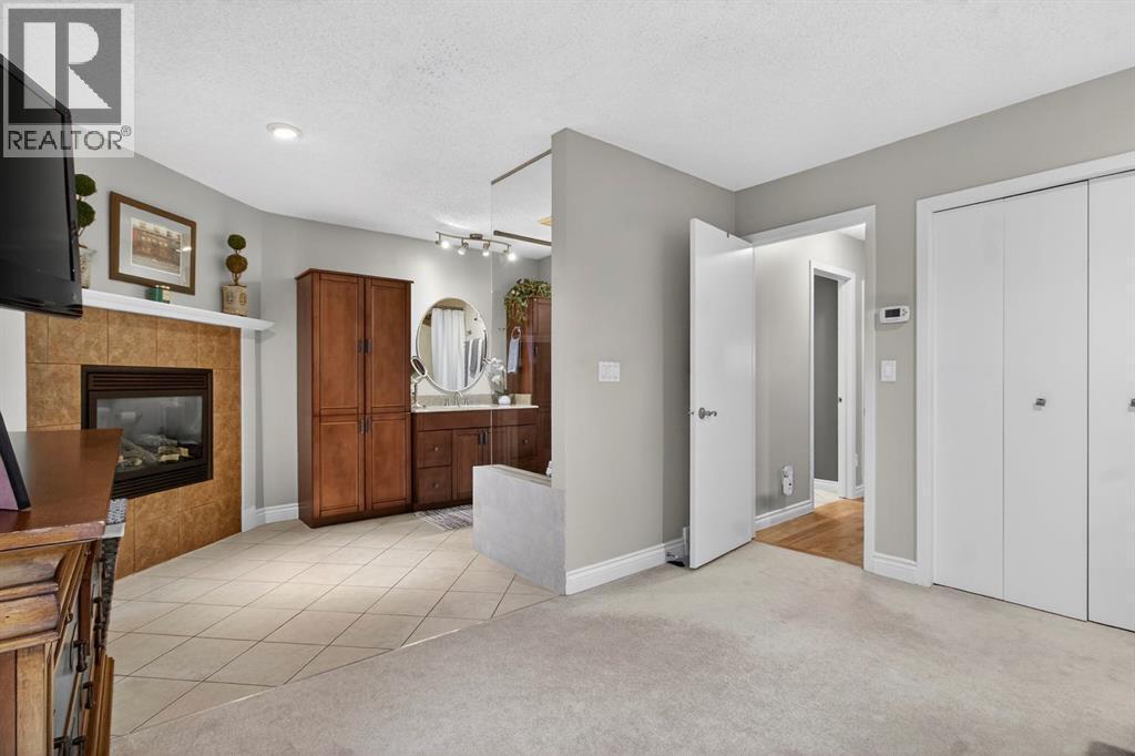 68 Bermondsey Rise Nw, Calgary, AB - Indoor With Fireplace