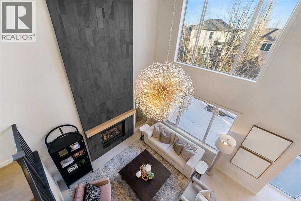 125 Discovery Place Sw, Calgary, AB - Indoor Photo Showing Other Room With Fireplace