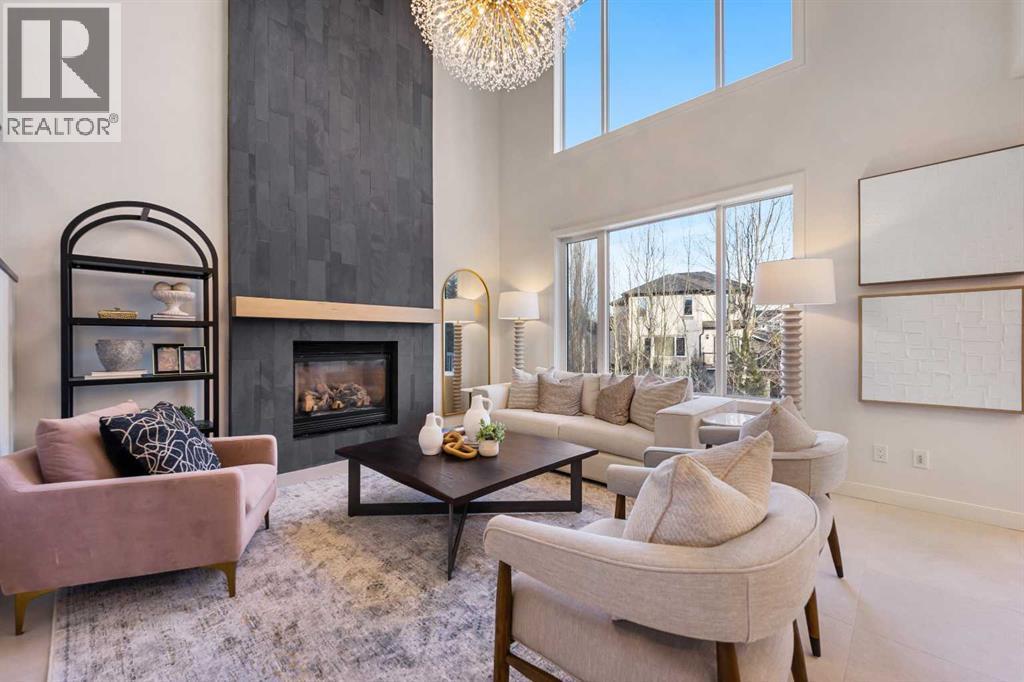 125 Discovery Place Sw, Calgary, AB - Indoor Photo Showing Living Room With Fireplace