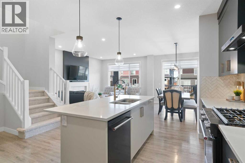 96 Emberside Glen, Cochrane, AB - Indoor Photo Showing Kitchen With Double Sink With Upgraded Kitchen