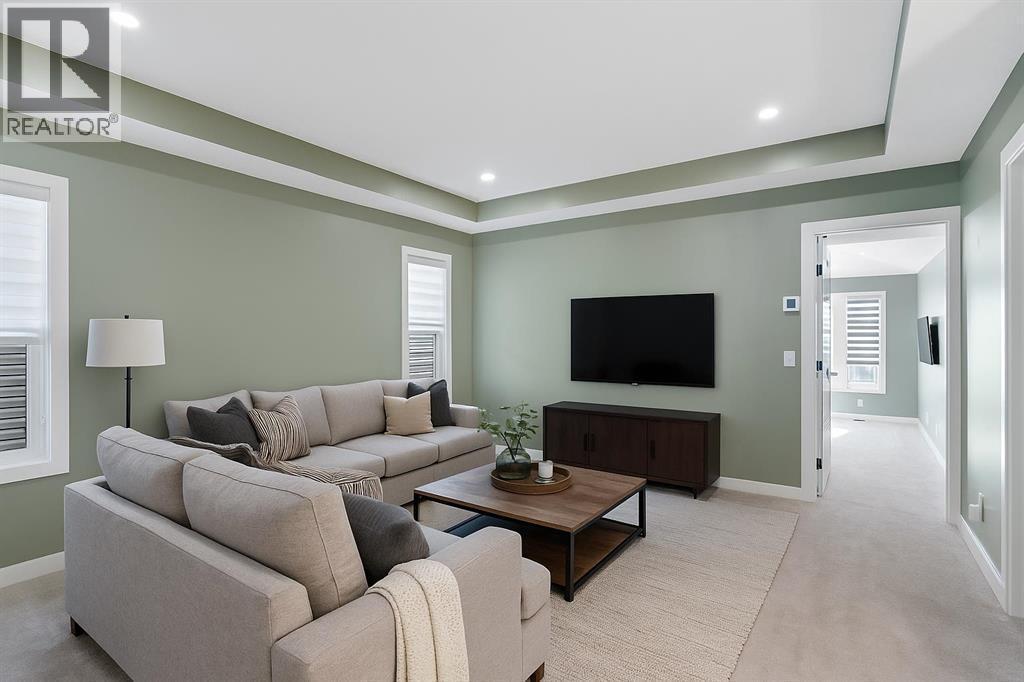 Virtually Staged - 96 Emberside Glen, Cochrane, AB - Indoor Photo Showing Living Room