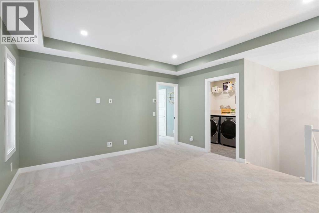 96 Emberside Glen, Cochrane, AB - Indoor Photo Showing Other Room