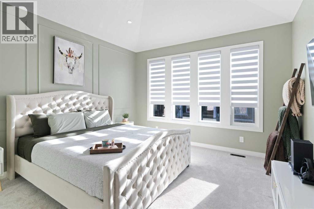 96 Emberside Glen, Cochrane, AB - Indoor Photo Showing Bedroom