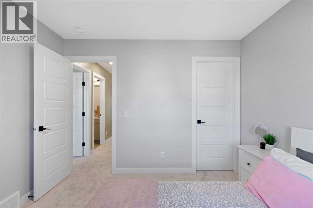 96 Emberside Glen, Cochrane, AB - Indoor Photo Showing Other Room