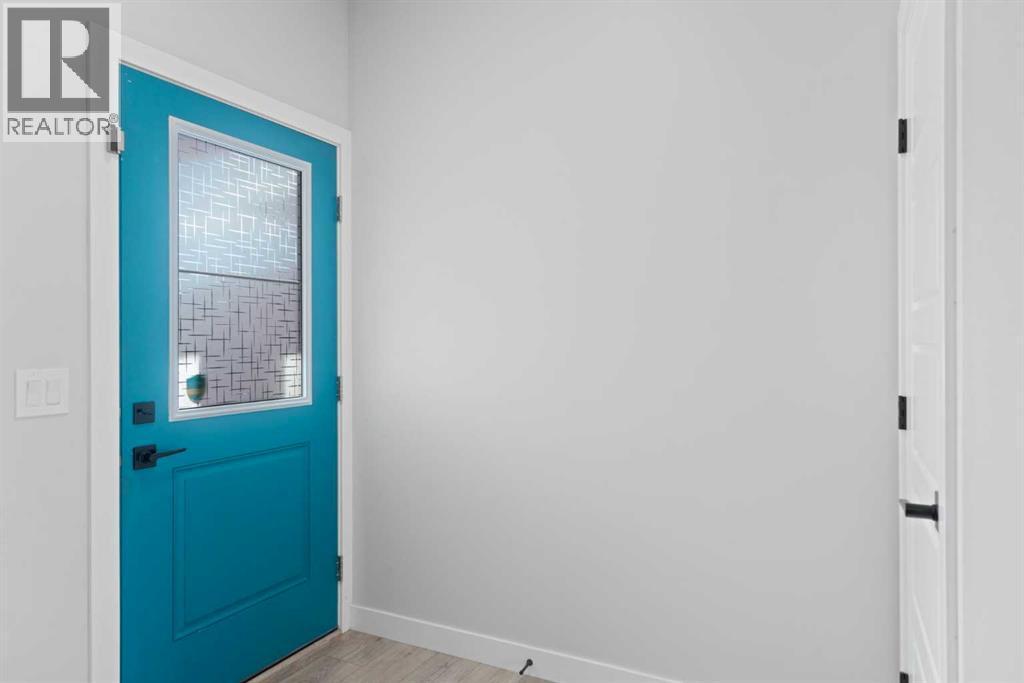 96 Emberside Glen, Cochrane, AB - Indoor Photo Showing Other Room