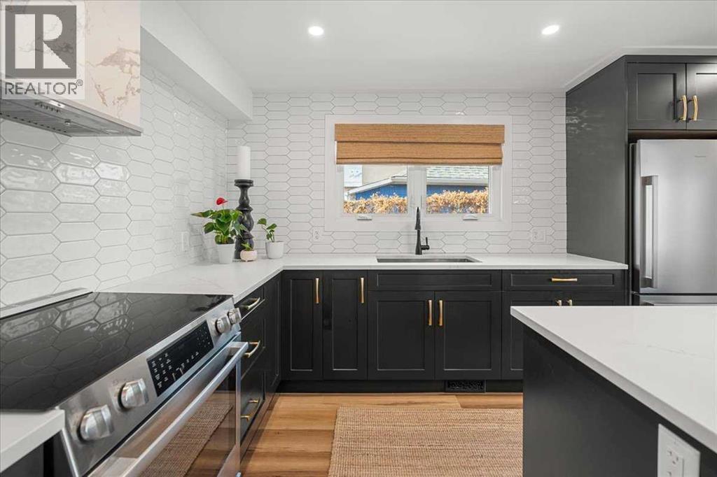 Main Floor - 2023 35 Avenue Sw, Calgary, AB - Indoor Photo Showing Kitchen With Upgraded Kitchen