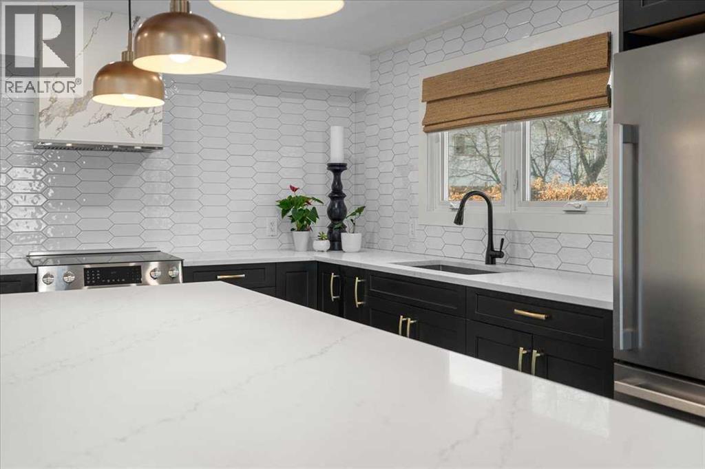 Main Floor - 2023 35 Avenue Sw, Calgary, AB - Indoor Photo Showing Kitchen With Upgraded Kitchen