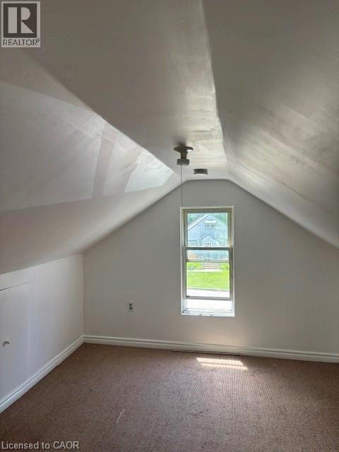upstairs,featuring sloped ceilings,carpeted flooring - 13 Second Avenue E, Simcoe, ON - Indoor Photo Showing Other Room