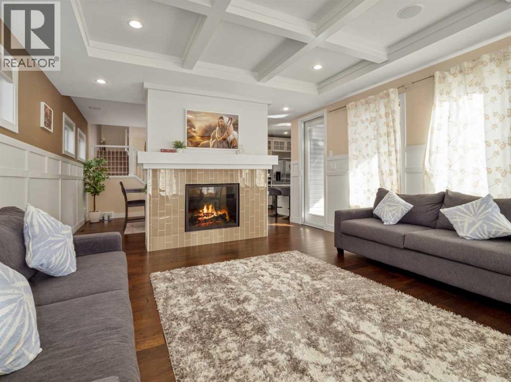 18 Northlander Road W, Lethbridge, AB - Indoor Photo Showing Living Room With Fireplace