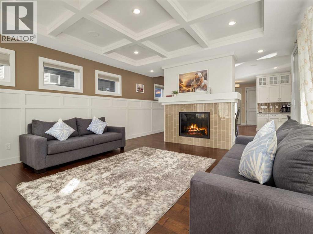 18 Northlander Road W, Lethbridge, AB - Indoor Photo Showing Living Room With Fireplace