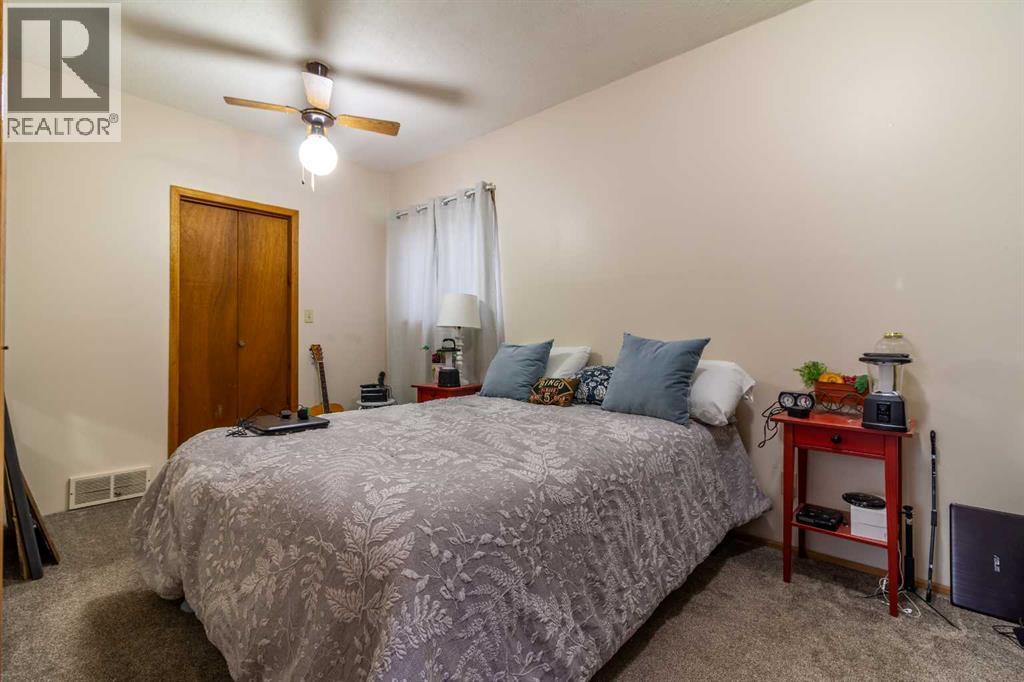 253 51 Avenue E, Claresholm, AB - Indoor Photo Showing Bedroom