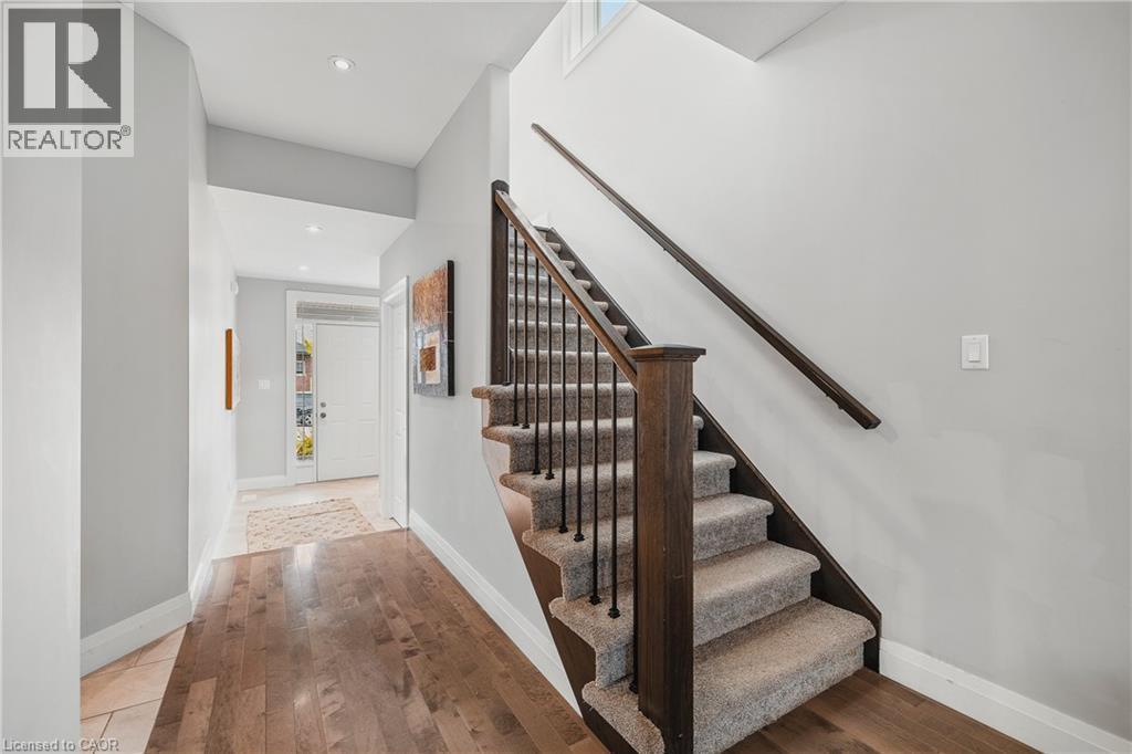 Stairs featuring hardwood / wood-style floors and recessed lighting - 346 Moorlands Crescent, Kitchener, ON - Indoor Photo Showing Other Room