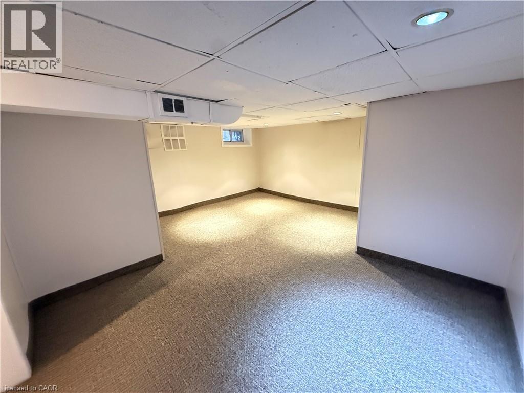 Basement featuring baseboards and a paneled ceiling - 24 Somerset Avenue, Hamilton, ON - Indoor