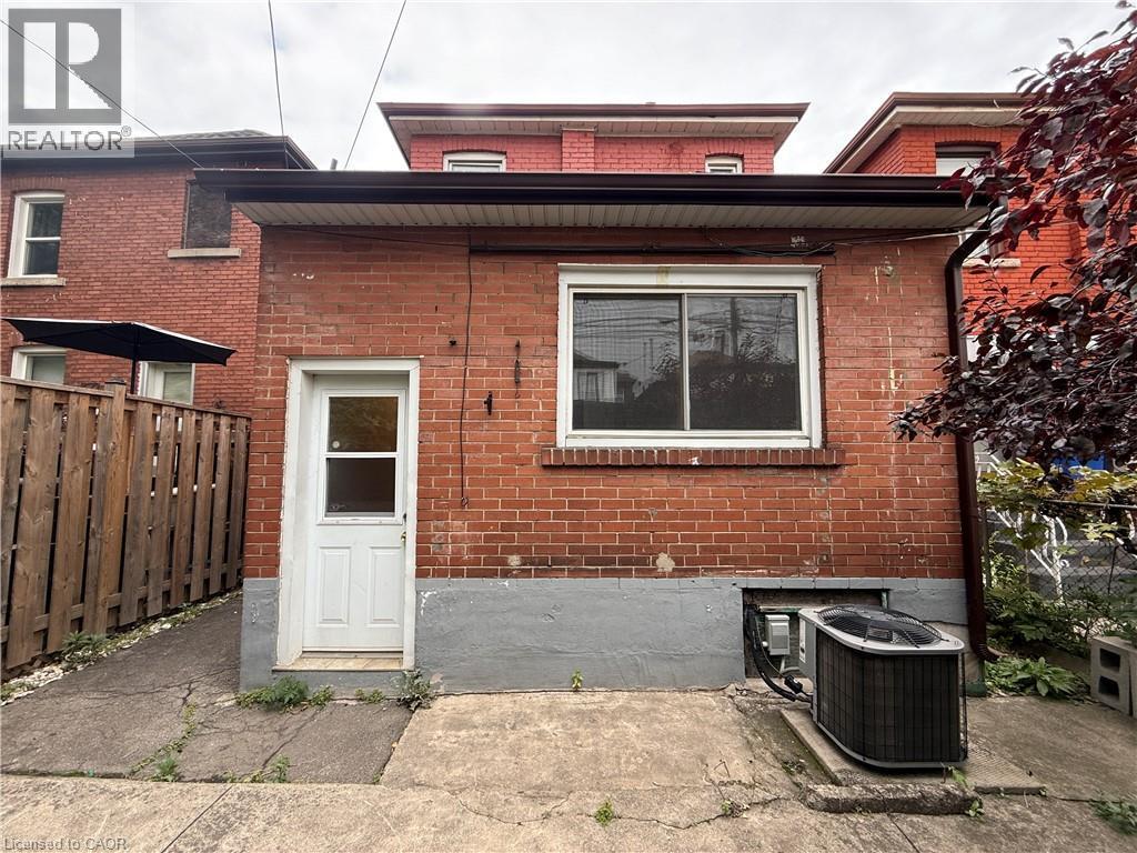 Rear view of property featuring brick siding - 24 Somerset Avenue, Hamilton, ON - Outdoor With Exterior