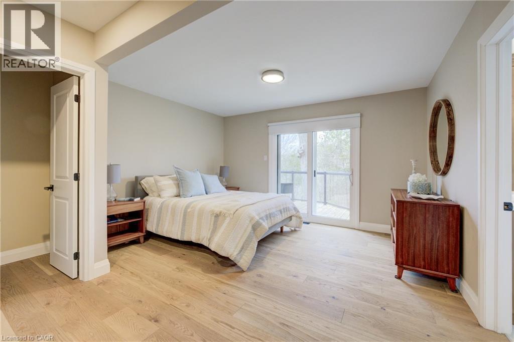 Bedroom featuring access to outside and light wood finished floors - 279 Ferndale Place, Waterloo, ON - Indoor Photo Showing Bedroom