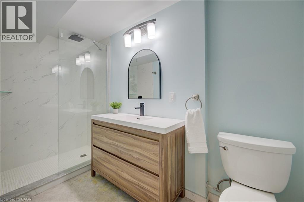 Bathroom featuring vanity and a marble finish shower - 279 Ferndale Place, Waterloo, ON - Indoor Photo Showing Bathroom