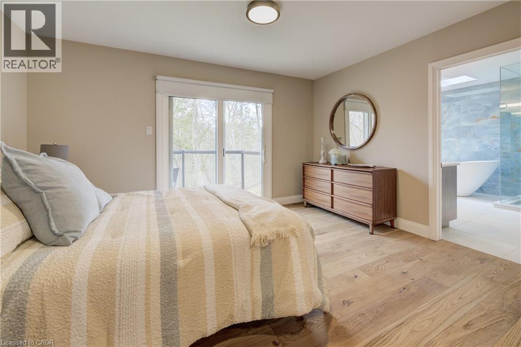 Bedroom featuring light wood-type flooring and access to exterior - 279 Ferndale Place, Waterloo, ON - Indoor Photo Showing Bedroom