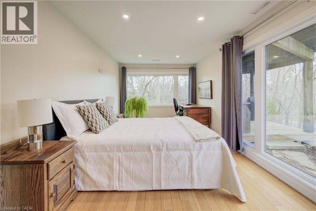Bedroom featuring light wood finished floors, access to exterior, and recessed lighting - 279 Ferndale Place, Waterloo, ON - Indoor Photo Showing Bedroom