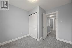 Unfurnished bedroom featuring carpet and a closet -