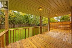 Wooden deck featuring a fenced backyard -