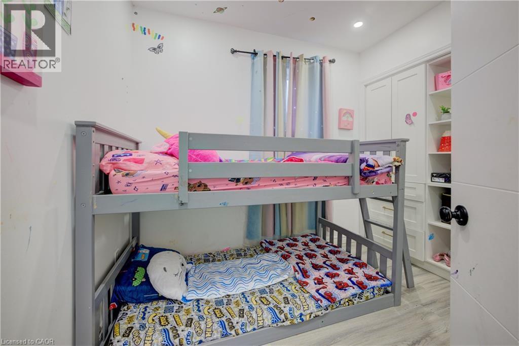 Bedroom with light wood-type flooring and recessed lighting - 31 Bonfair Court, Kitchener, ON - Indoor Photo Showing Bedroom