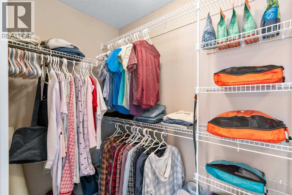 Generous Walk In Closet - 5 Mahogany Square Se, Calgary, AB - Indoor With Storage