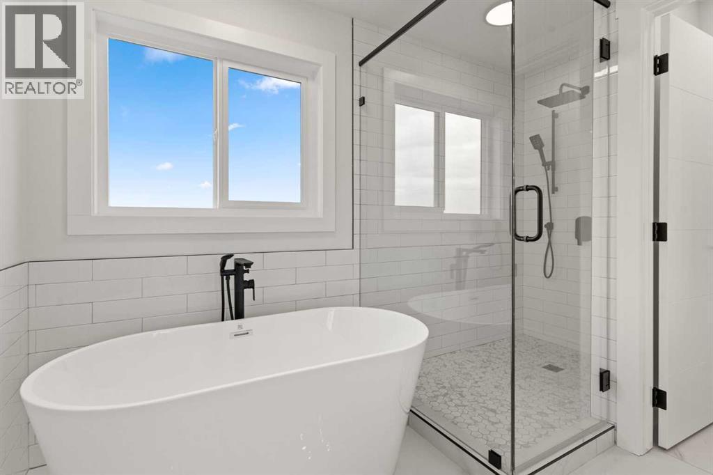 Picture is from a recent build by the builder with similar finishes and will be similar but not an exact match - 53 Heritage Park, Cochrane, AB - Indoor Photo Showing Bathroom